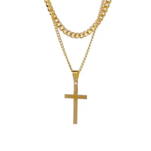 Detailed view of gold double-layer hip hop necklace with Cuban chain and cross pendant.