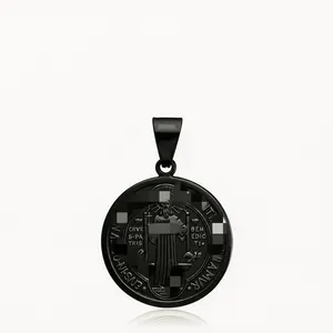Detailed macro view of black stainless steel St. Benedict medal pendant with fine engraving