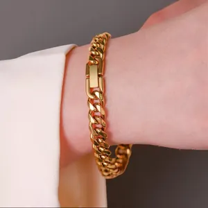 Detailed view of gold stainless steel Cuban link bracelet with jewelry clasp