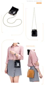 Model wearing a vintage black leather kiss-lock phone bag with a gold chain strap