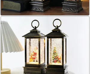 Close-up of vintage Christmas snow globe lanterns with glowing Santa and tree scene