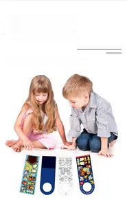 Close-up detail of children playing with DIY Christmas Nativity scene door hanger stickers