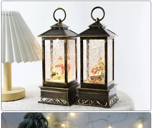 Close-up detail view of retro bronze Christmas snow globe lanterns with warm internal lighting