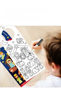 Detail of a child coloring a Christmas nativity scene DIY door hanger craft