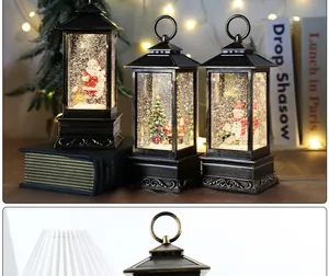 Detailed view of vintage Christmas snow globe lanterns with Santa and snowman motifs.
