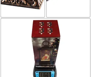 Detailed view of Christmas music box lantern package weighing 1160.7g on a scale