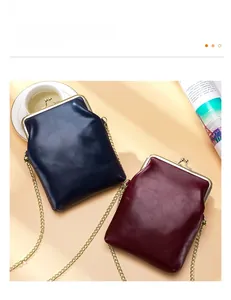 Vintage leather kiss-lock phone bags in navy and burgundy with elegant gold chains