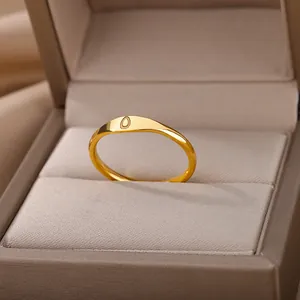 Detailed view of an elegant gold letter ring with letter O engraving in a jewelry box