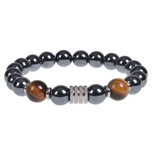 Macro detail of 10mm obsidian and natural tiger eye stone beaded bracelet for men
