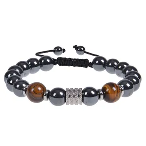 Macro detail of men's 10mm obsidian and tiger eye bead bracelet with stainless steel accent.
