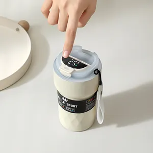 Close-up view of the intelligent digital temperature display on an insulated coffee mug lid