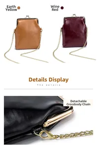 Detail of genuine leather vintage kiss-lock bag with detachable gold chain