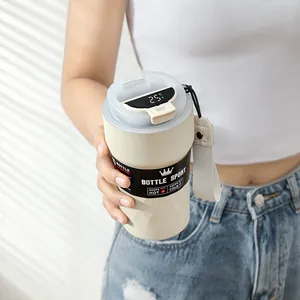 Close-up view of smart temperature display on insulated stainless steel coffee mug