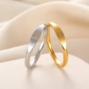 Minimalist unisex stainless steel closed rings with custom engraved K and M letters