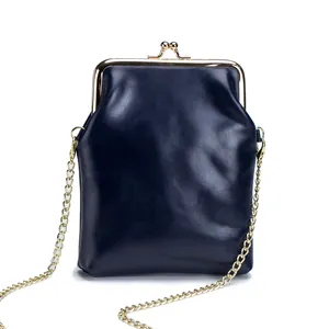 Vintage navy blue genuine leather kiss-lock crossbody bag with a gold chain strap