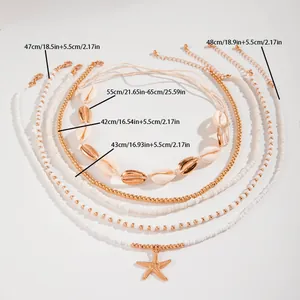 Boheemse kralen enkelbandjes set met zeester hanger en kaurischelpen met maatvoering.