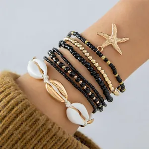 Set de 7 pulseras bohemias de cuentas con dijes de estrella de mar y conchas de mar