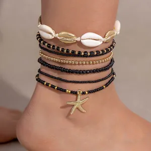Conjunto de tobilleras bohemias multicapa con conchas, cuentas y estrella de mar