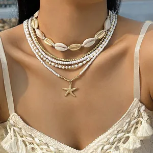 Juego de collares boho de varias capas con conchas y colgante de estrella de mar