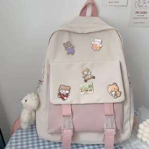 Cute Korean style pink and beige school backpack for girls with decorative bear pins