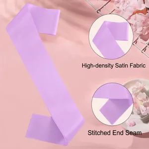 Close-up detail of high-density purple satin sash showing stitched hem for party use