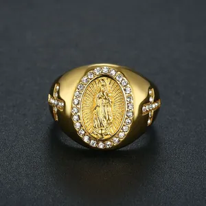 Close-up detail of a gold-plated stainless steel hip hop ring with Virgin Mary and stones