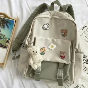 Simple mori-style beige and green canvas backpack for girls with cute bear plush charm
