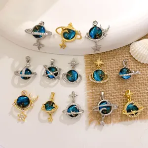 Detailed view of dreamy planet galaxy pendants with starry blue orbs and crystal star charms