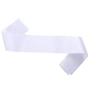 Close-up detail view of a blank white satin sash for DIY party etiquette and events