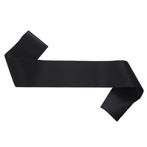 Detailed view of a blank black satin sash for DIY party customization