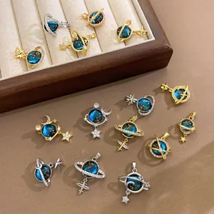 Detail view of various exquisite fantasy planet charms in gold and silver finishes.