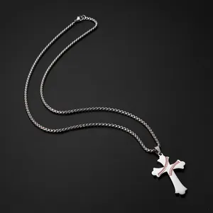 High-quality detail shot of a stainless steel cross necklace with baseball stitching