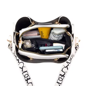 Stylish white bucket bag with large capacity and printed wide strap