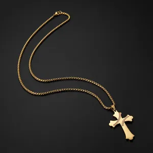 Gold-plated stainless steel baseball cross necklace detail with red stitching on black