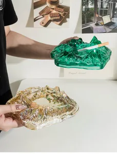 Handheld detail view of premium crystal glass Mount Fuji mountain peak shaped ashtrays