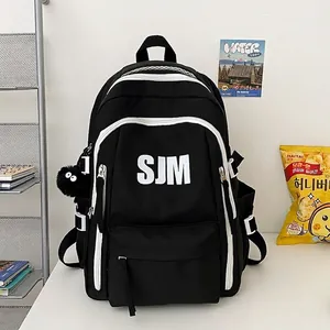Zaino vintage nero capiente per studenti con cerniere a contrasto bianche e stampa SJM