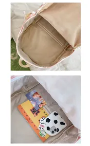 Detailed interior view of a pink tie-dye student backpack showing its large storage capacity