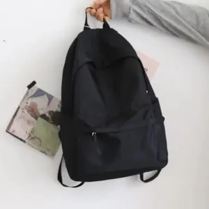 Sac à dos noir minimaliste léger avec grande capacité pour étudiants et voyage