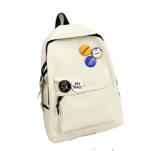 Sac à dos de voyage minimaliste de grande capacité avec badges décoratifs pour l'école