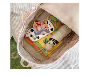 Detailed internal view of a tie-dye printed student backpack showing its large capacity
