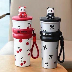 Detailed view of cute portable panda water cups with cherry and bow patterns and hand strap.
