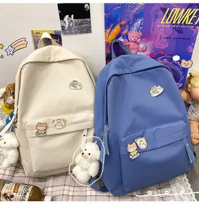 Zaini minimalisti in stile coreano in crema e blu con spille e ciondoli a forma di orso