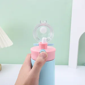 Close-up of cute pink and blue water bottle showing one-click lid mechanism