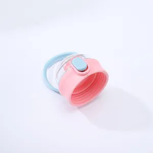 Close-up of pink and blue water bottle lid with carrying handle and flip-top