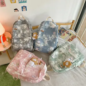 Assorted tie-dye printed backpacks in four colors for cute student school and travel use