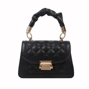 Fashionable black quilted mini handbag with unique scrunchie top handle for stylish women