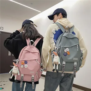 Large capacity student laptop backpacks in pink and sage green for men and women