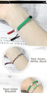 Hand-woven bracelet in red green white and black flag colors shown on a person's wrist