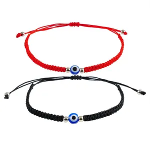 Detailed view of red and black adjustable braided Turkish evil eye bracelets