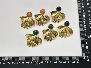 Detailed top view of 18K gold plated irregular fan earrings with colorful stones.